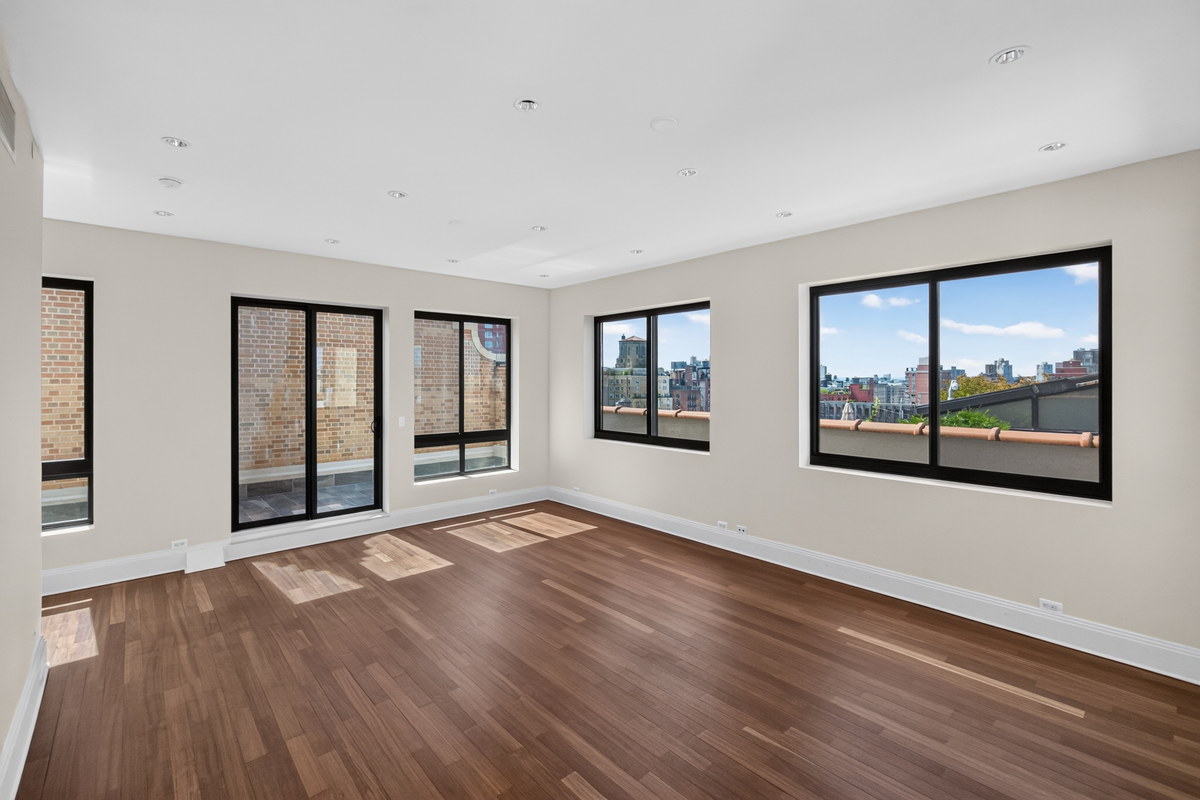 45 West 81st Street PHA room with wood floors, sliding doors to terrace and city views