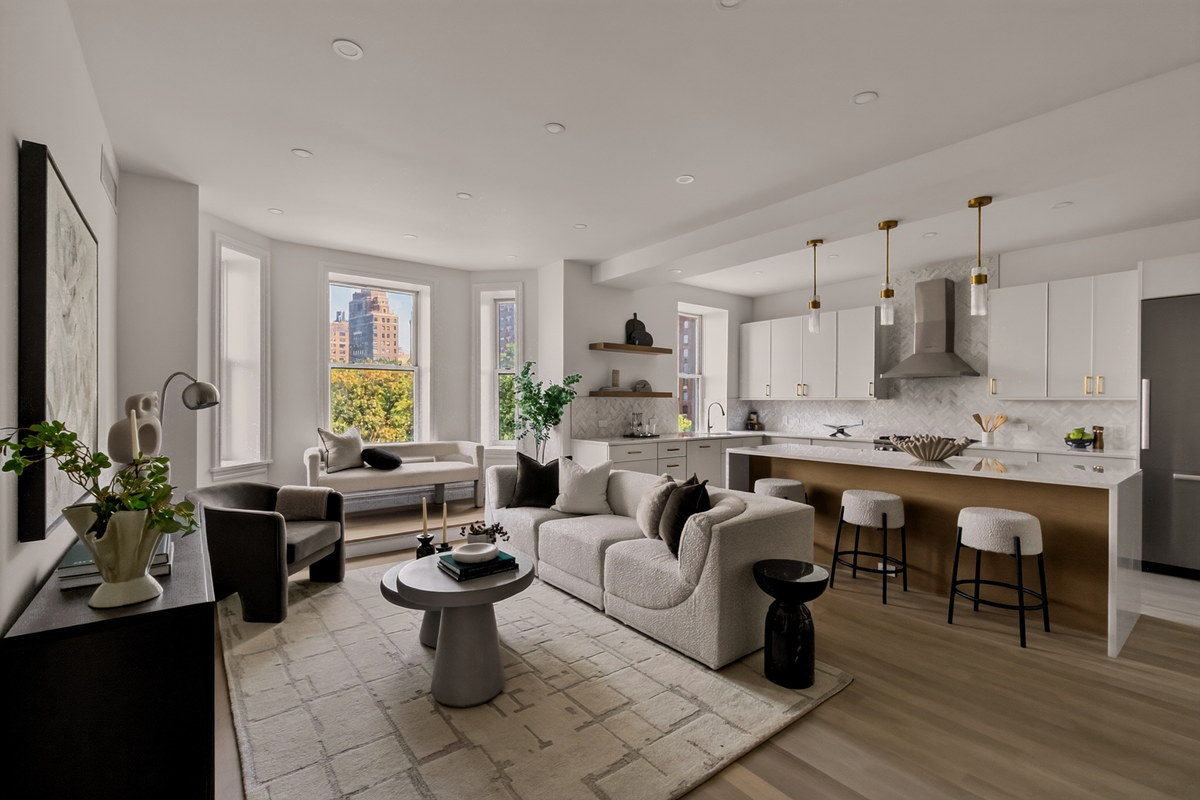 Staged open living and kitchen with chevron backsplash