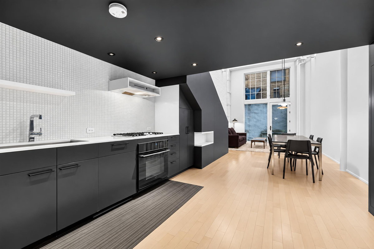 39 East 12th Street #110 kitchen and dining with industrial windows